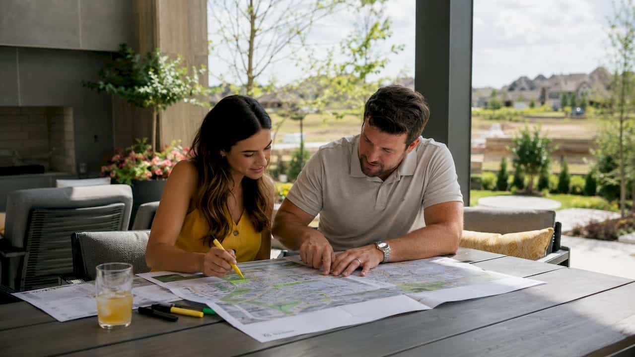Couple reviewing community plans at home