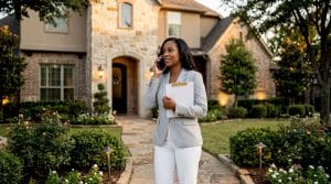Real estate agent at Southlake luxury home exterior